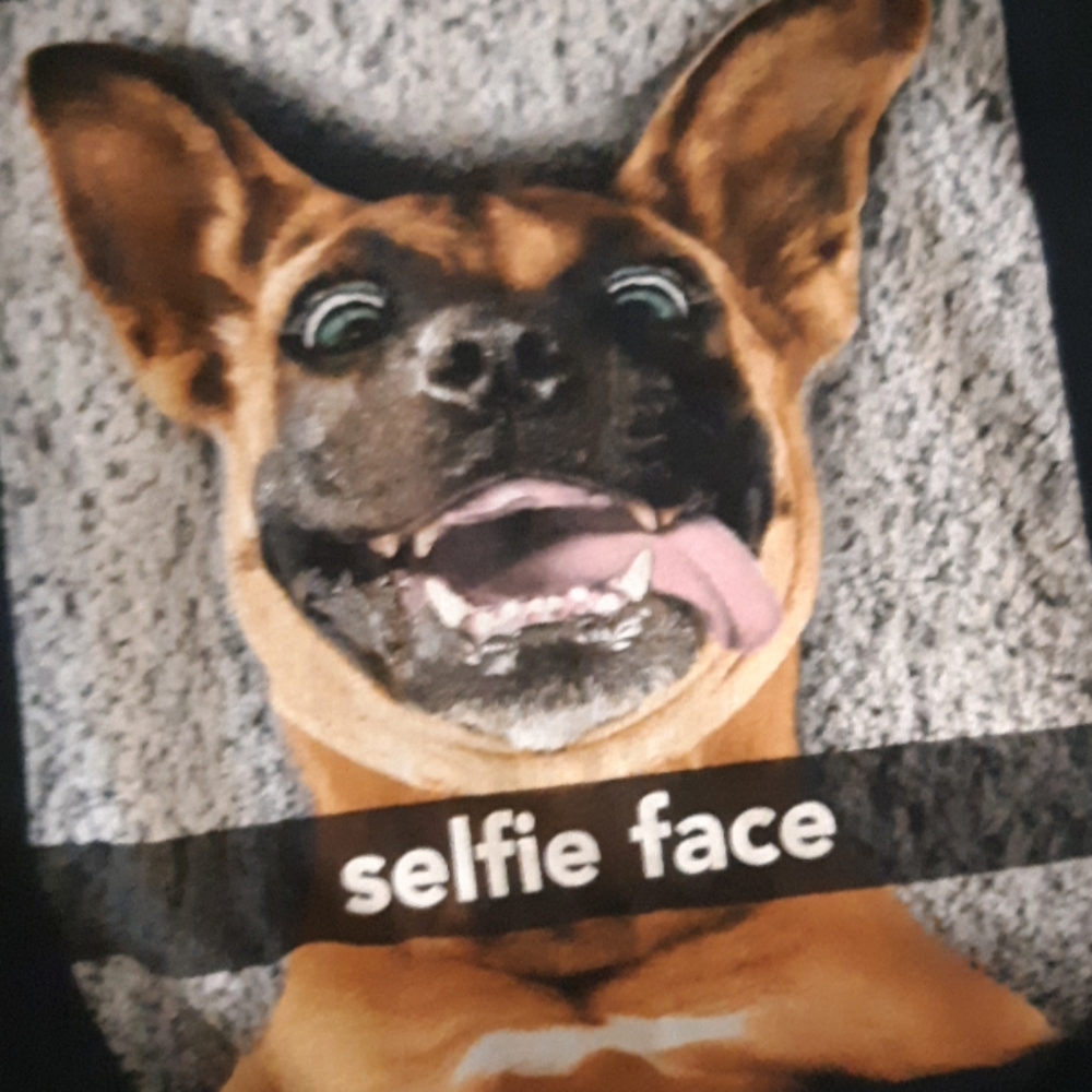 A t-shirt with a dog on the front